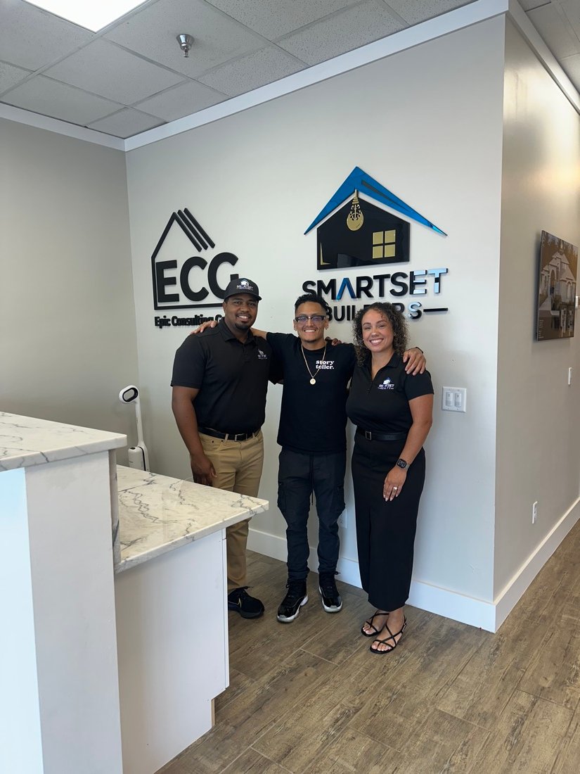 The team with clients at the ECG and SmartSet Builders office